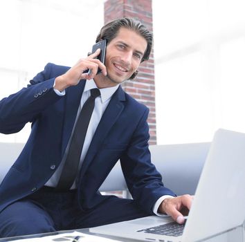 confident businessman in his office. photo with copy space