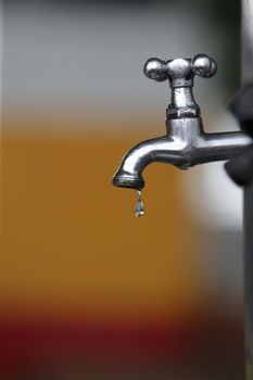 feira de santana, bahia, brazil - june 10, 2022: drop of water dripping on a tap of a gas station in the city of Feira de Santana.