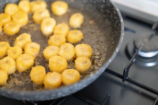 Process of cooking caramelized banana in a frying pan at home Selective focus Healthy