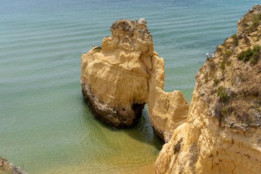 The rocky cliffs of Vale do Olival beach in Armacao de Pera, Portugal. High quality 4k footage