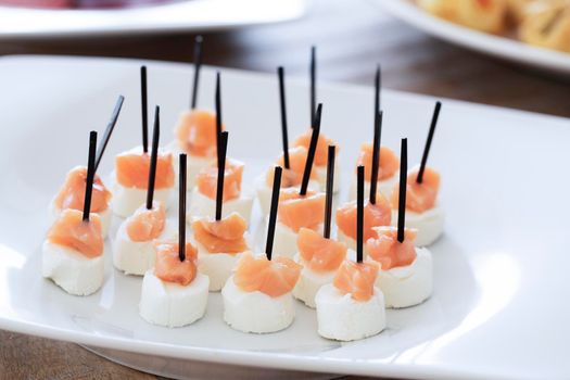 Platter with salmon and cream cheese appetizers.