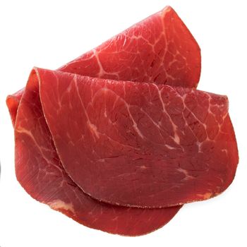Slices of bresaola, cured beef, isolated on a white background