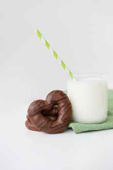 Traditional German Christmas chocolate gingerbread lebkuchen. Cookies along with a glass of milk are on the table