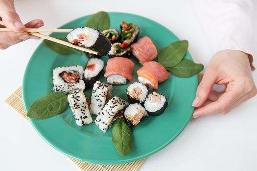 Meals, various types of maki sushi, philadelphia, maki, salmon, rice, salad Delicious and healthy food