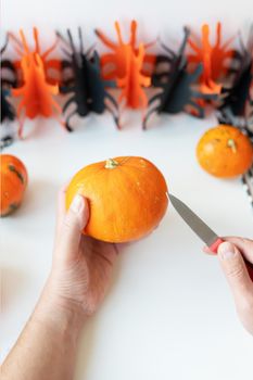 Halloween October 31st. The step-by-step process of carving a pumpkin. View from above