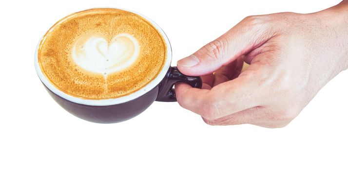 A hand take a cup of coffee latte with heart shape foam milk isolated white background with clipping path.
