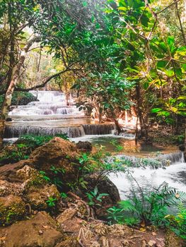 Huay Mae Khamin waterfall in Kanchanaburi, Thailand South east asia Jungle landscape with amazing turquoise water of cascade waterfall at deep tropical rain forest. travel landscape and destinations