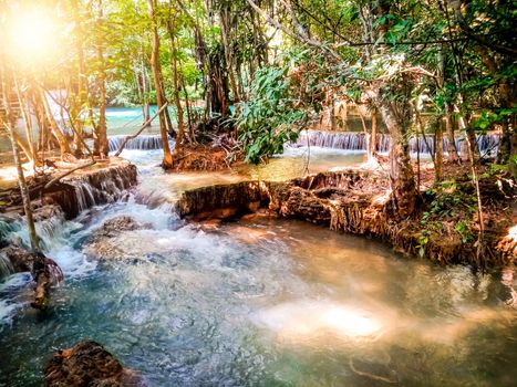 Huay Mae Khamin waterfall in Kanchanaburi, Thailand South east asia Jungle landscape with amazing turquoise water of cascade waterfall at deep tropical rain forest. travel landscape and destinations