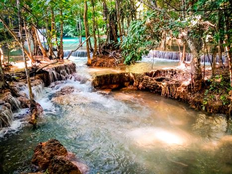 Huay Mae Khamin waterfall in Kanchanaburi, Thailand South east asia Jungle landscape with amazing turquoise water of cascade waterfall at deep tropical rain forest. travel landscape and destinations