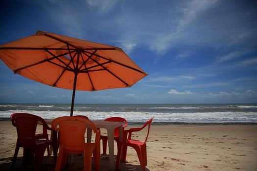 conde, bahia, brazil - january 8, 2022: umbrella and chair on the beach of Sitio do Conde on the North Coast of Bahia