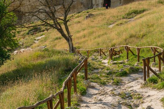 Ancient cave bakhchisaray chufut city road crimea medieval fortress stone, concept history blue in historic for russia chufut, autumn landmark. Defensive scene moutain,