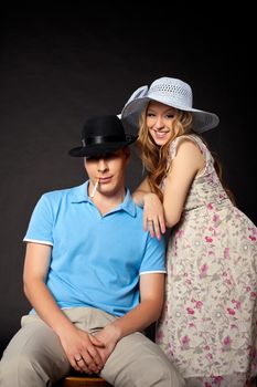 Young couple portrait with pregnant woman in country style cloth