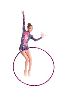 Young beautiful girl as professional gymnast dance with hoop isolated