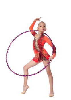 Young beautiful girl professional gymnast stand with hoop isolated