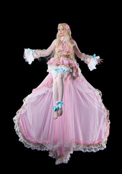 Attractive girl in fary-tale doll cosplay costume fly in dark