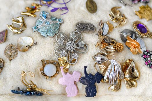 DIEPPE, FRANCE - NOVEMBER 17, 2019: Vintage brooches sold at the flea market in France