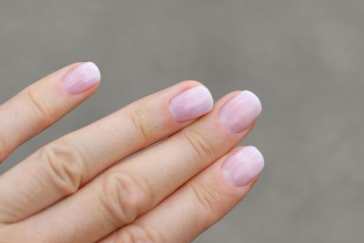 Nude, beige gel extended manicure on nails
