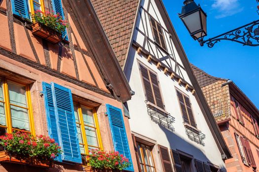 Riquewihr beautiful alsatian architecture at springtime with flowers, Eastern France
