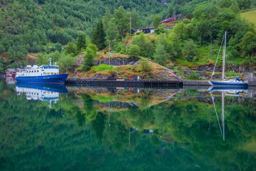 Majestic naeroyfjord with ferry and sailboat in western Norway, Scandinavia