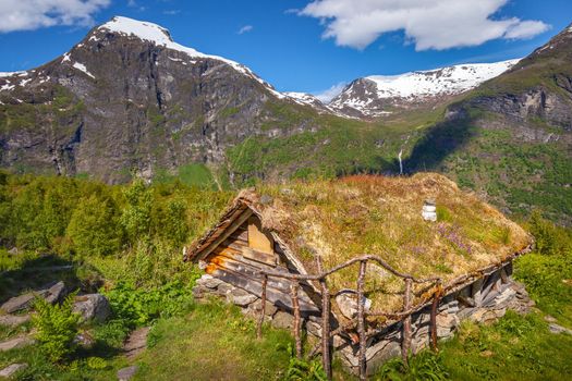 Geiranger typical rustic barn in More og Romsdal at dramatic sky, Norway, Northern Europe