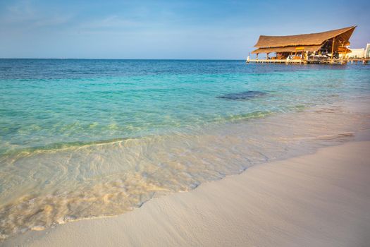 Tropical paradise: Cancun idyllic caribbean beach with with rustic palapa pier, Riviera Maya, Mexico