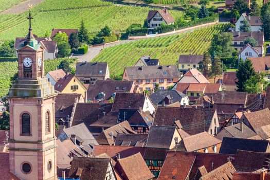 Riquewihr beautiful alsatian architecture at springtime with vineyards, Eastern France