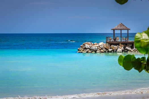 Tropical paradise: idyllic caribbean beach with pier and gazebo, Montego Bay, Jamaica