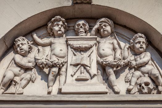 Amsterdam ancient mural with skulls and cherubs, dutch architecture, Netherlands