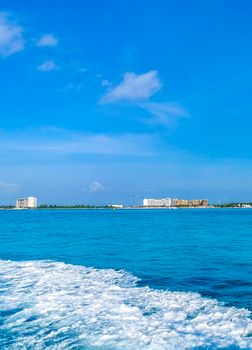 Boat trip from Cancun to Island Mujeres Isla Contoy and Whale shark tour with natural tropical beach seascape panorama blue turquoise green clear water and view from boat in Quintana Roo Mexico.