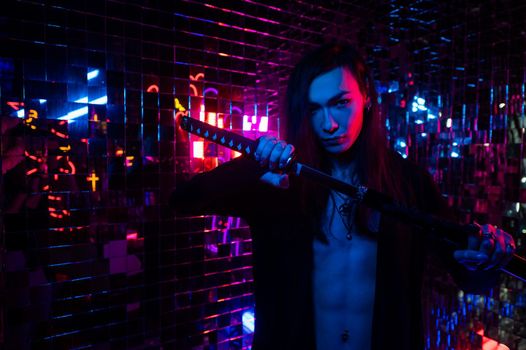 Male transgender neon light studio. Asian with samurai sword