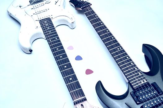 A stringed musical instrument, with a fretted fingerboard, typically incurved sides, and six or twelve strings, played with the fingers or a plectrum. Two guitar, neck fretboard