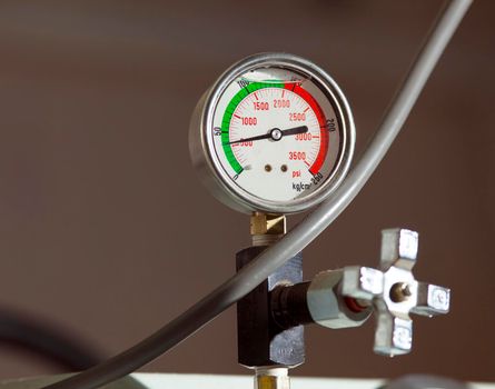 industrial pressure barometer close-up at green line