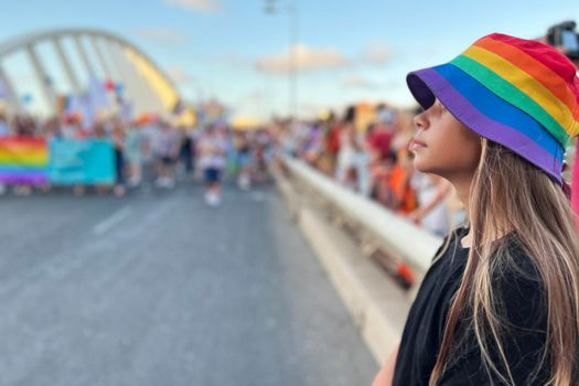 Seattle Pride Parade. Child wearing rainbow colors to support the Pride parade.