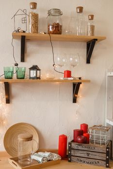 The kitchen is decorated in a Christmas style with red accents. Cozy atmosphere of winter holidays.