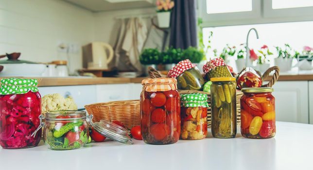 Jars with preserved vegetables for the winter. Selective focus. Food.