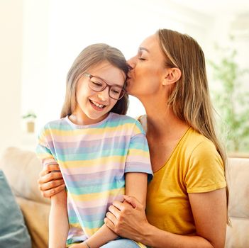 mother and daughter playing and having fun at home