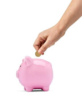 Close up of a pink piggy bank on white background