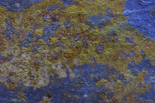 Abstract background from a time and weather-damaged painted wall. Moldy blue wall with damaged paint.