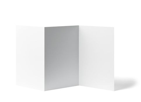 close up of a blank folded leaflet white paper on white background