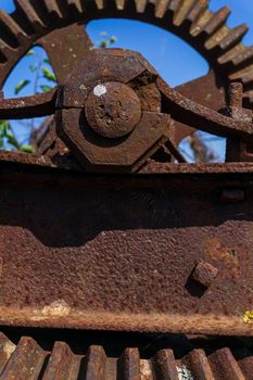 Old rusty gears details of the mechanism of an old abandoned mill close up