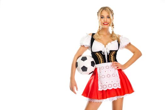 Half-length portrait of young sexy blonde with big breast wearing color dirndl with white blouse holding the beer mug Isolated on blue background