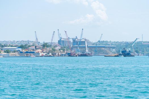 RUSSIA, CRIMEA - JUL 08, 2022: Sea sevastopol ship port crimea fleet naval base transport summer, concept tower urban from landmark from sky town, navy Marine. ,