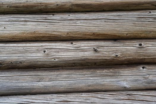 House wall in the village. Russian masonry of logs in the southern Urals