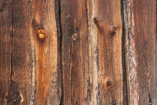 Wooden barn wall made of boards in russian village