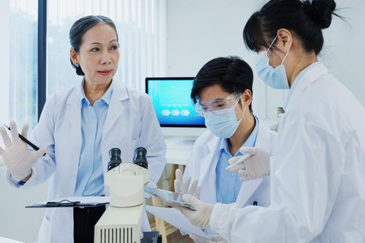 medical research laboratories, scientists analyze chemical samples Discuss technological innovations. Advanced scientific laboratories for medicine, biotechnology