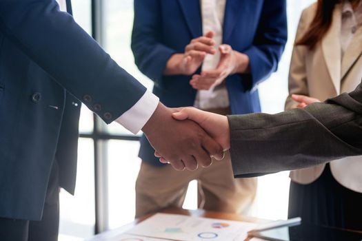 businessman handshake for teamwork of business merger and acquisition.