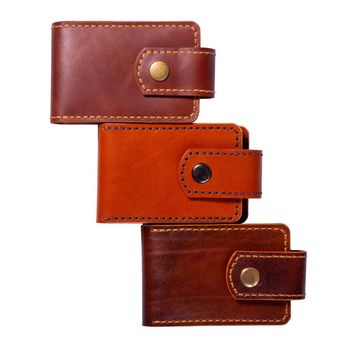Set of three luxury craft business card holder cases made of leather. Brown Leather boxes for cards isolated on white background.