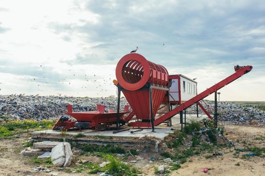 sorting machine at a large landfill