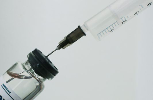 Covid -19 vaccine vial and syringe. Medical concept.