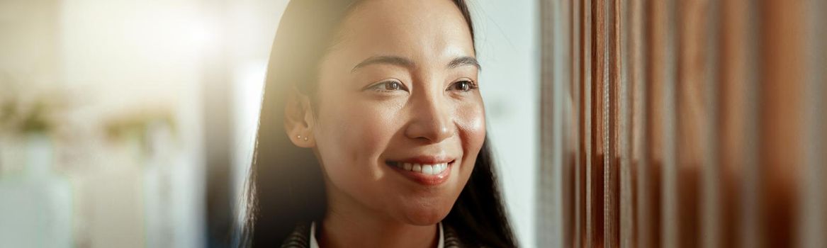 Portrait of attractive asian business woman standing in modern office and looking away